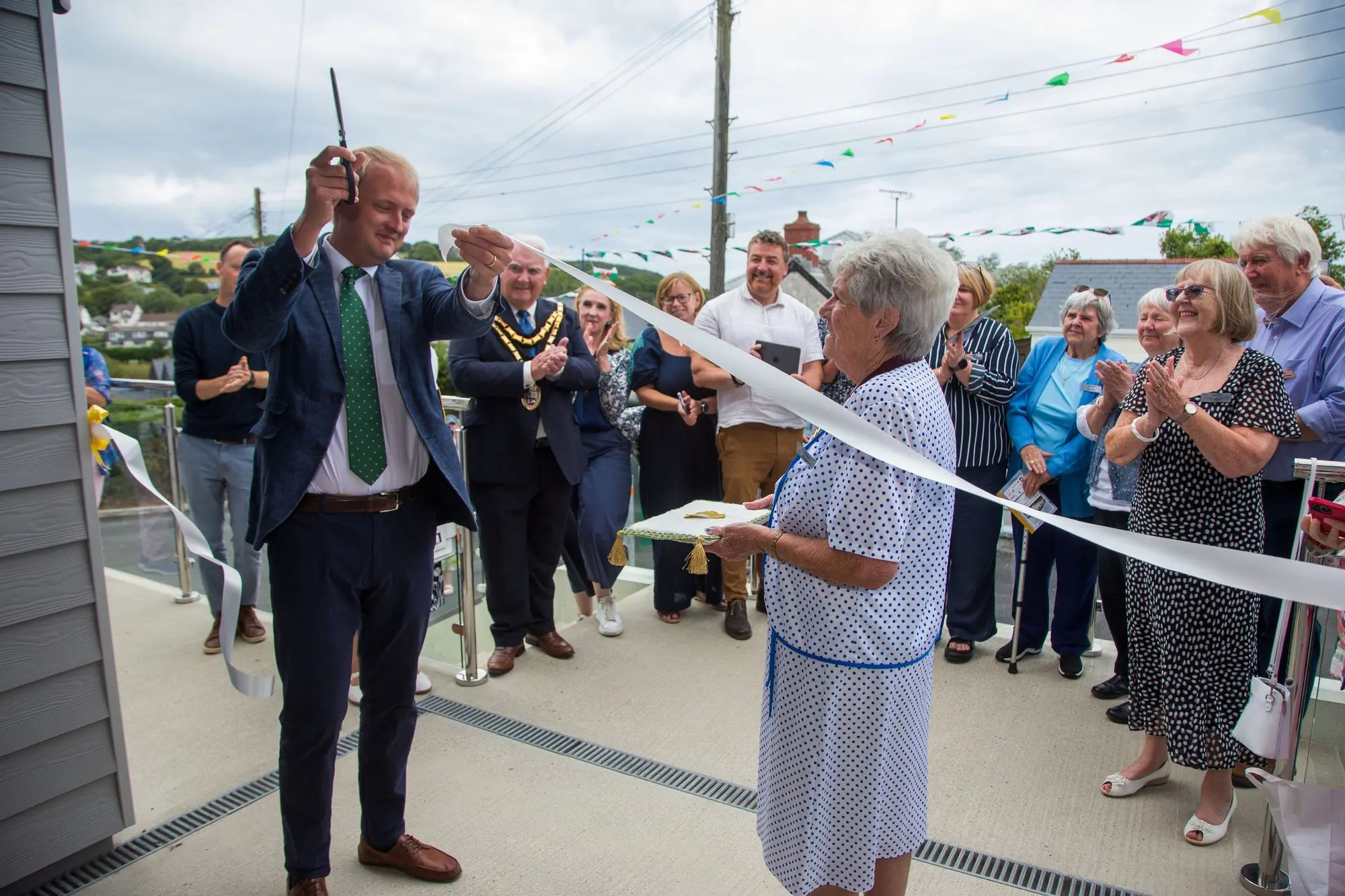 Cutting the ribbon at the official opening of the new hall