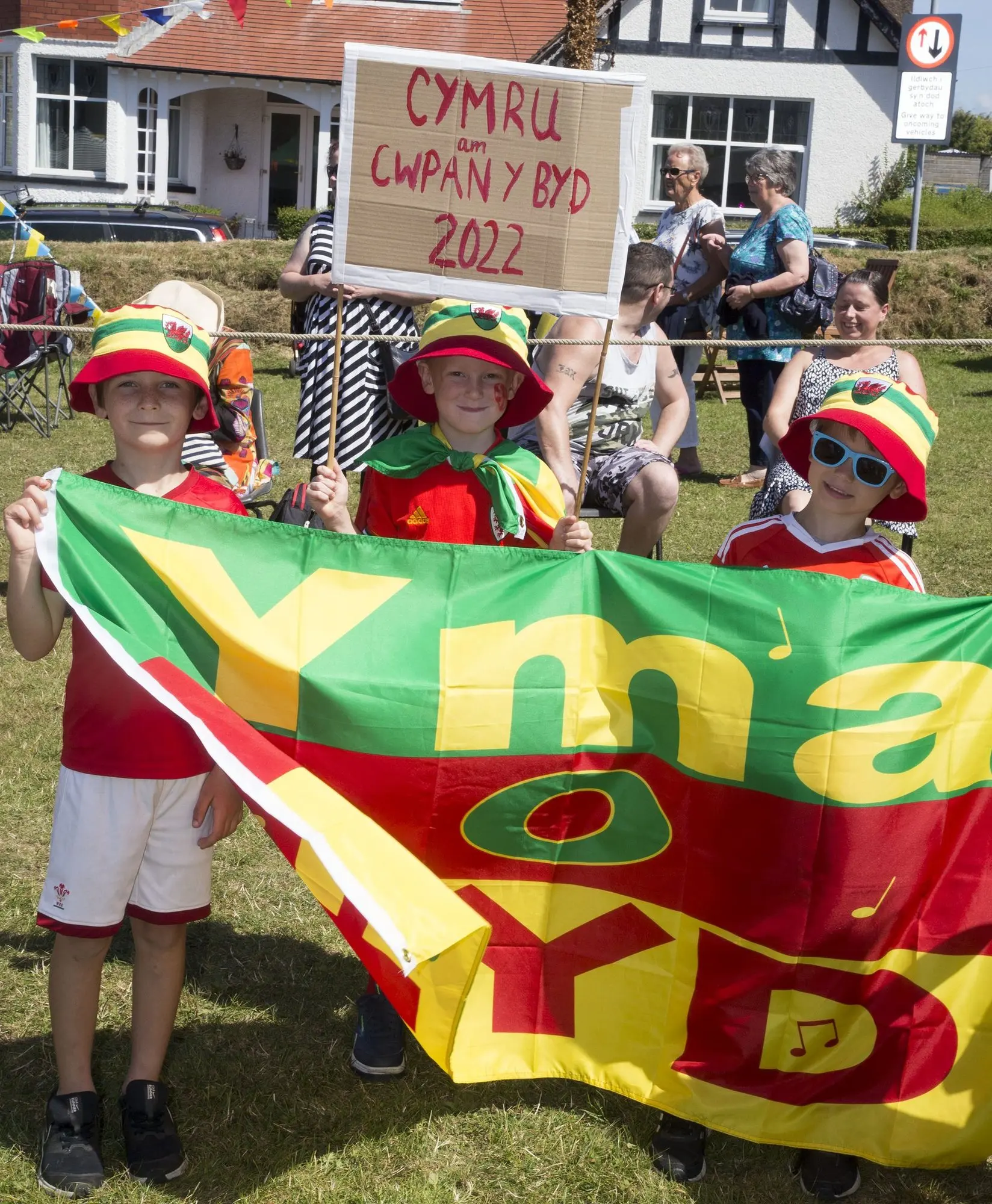 Young supporters with a Yma o Hyd flag at the carnival